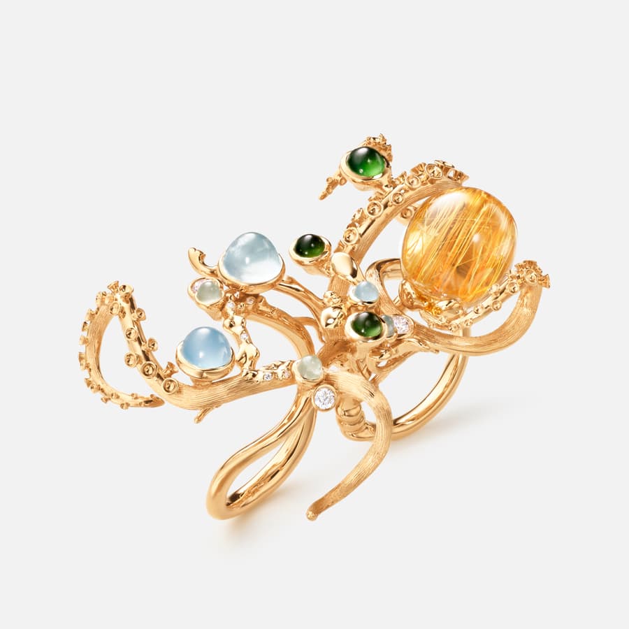 Octopus ring in 18k Gold with Aquamarines, Serpentines, a large Rutile Quartz and Diamonds | Ole Lynggaard